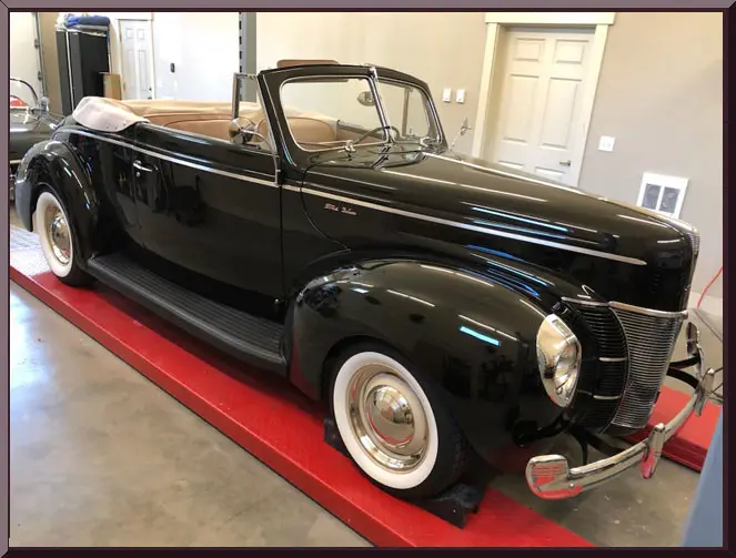 Vintage black convertible car in garage