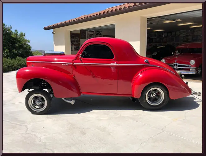 Retro red automobile in driveway