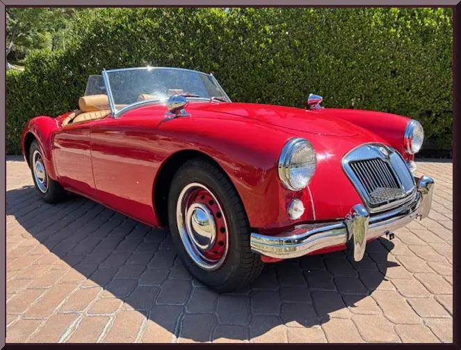 Shiny retro car with tan interior.