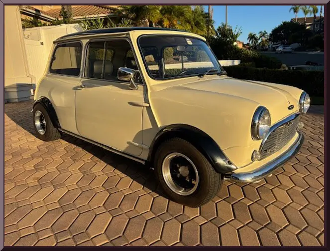 Vintage Mini Cooper on cobblestone driveway