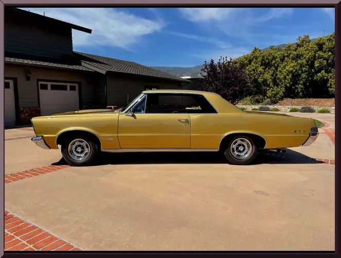 Classic car outside suburban home