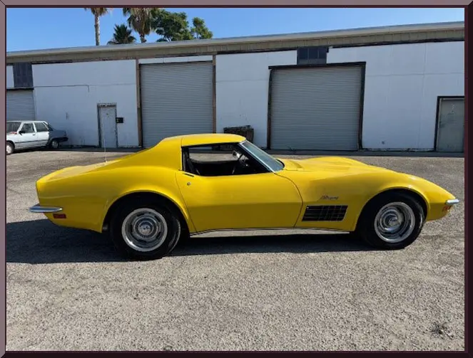 Classic yellow car in industrial area