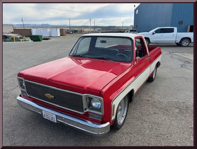 Retro pickup truck under cloudy sky