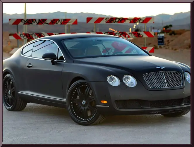 Luxury black car on desert road