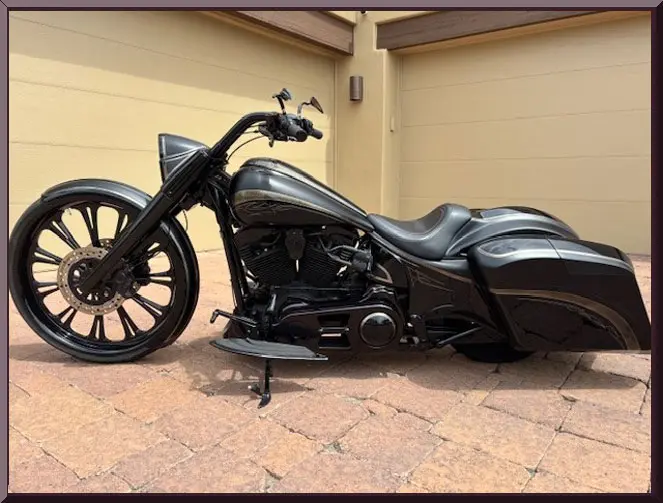 Stylish motorcycle parked near beige garage door.