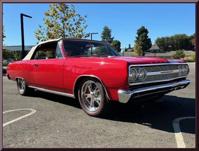 Vintage red convertible car in sunlight