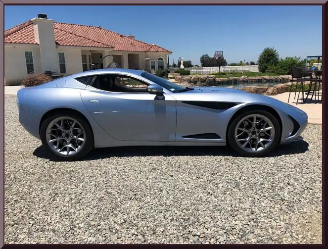 Luxury vehicle on gravel driveway