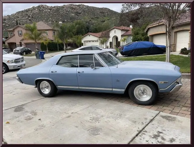 Classic car with residential backdrop