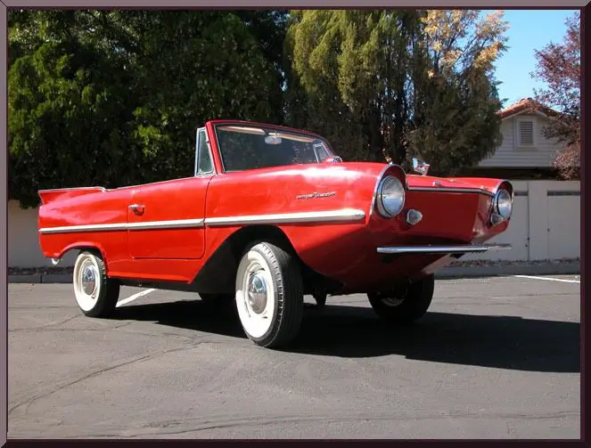 Classic red amphibious vehicle in sunlight