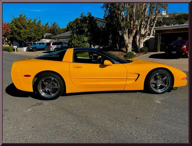Yellow sports car parked on street