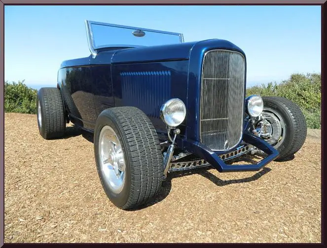 Vintage car parked on gravel