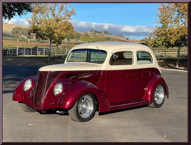 Classic car parked under blue sky