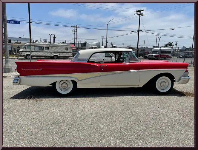 Retro car parked on sunny street