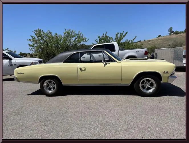 Classic yellow car parked outdoors