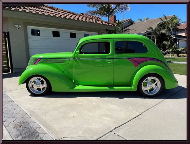 Retro vehicle beside suburban house
