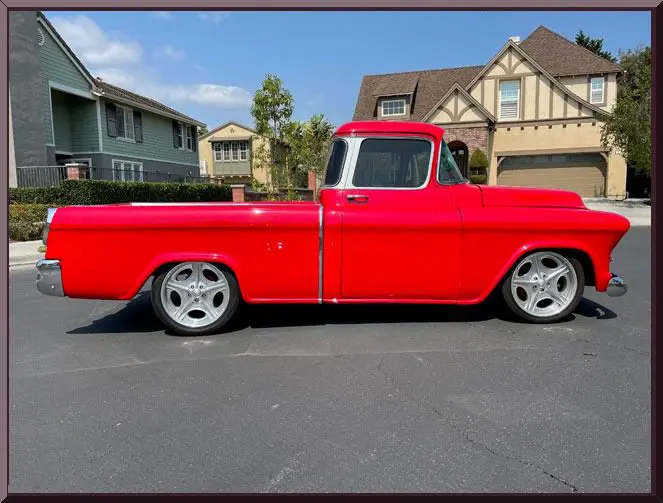 Red vintage truck parked on street