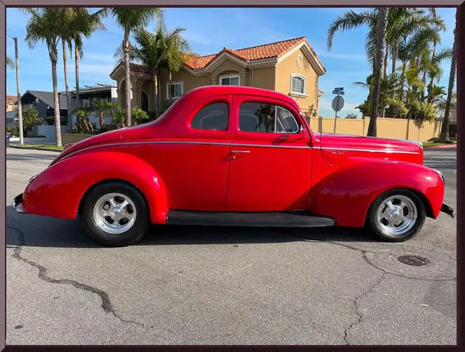 Retro red coupe with palm trees