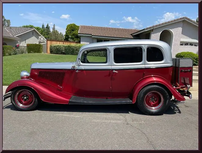 Retro automobile in suburban neighborhood setting