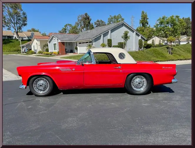 Red vintage car on suburban street