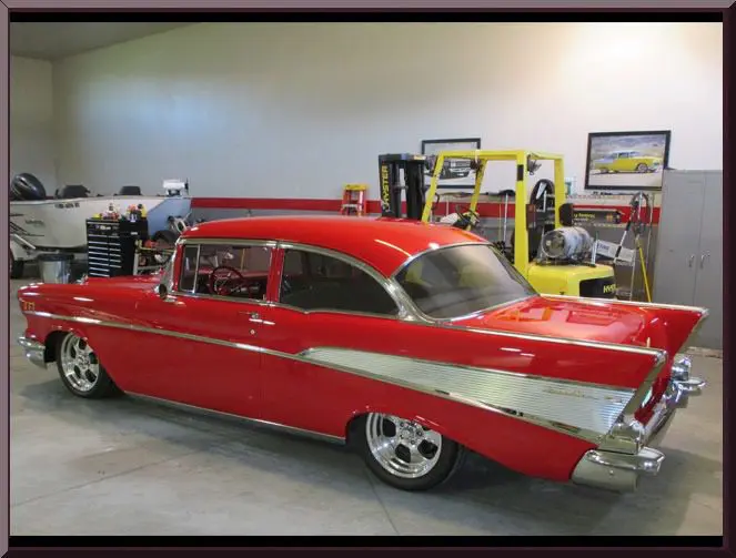 Vintage red vehicle parked indoors