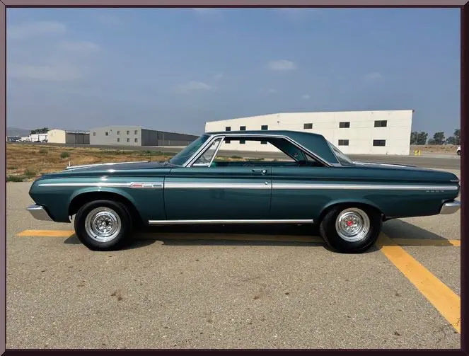 Classic green car on empty road