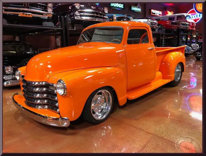 Vintage orange truck with shiny chrome