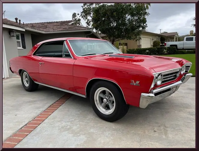Classic red car on driveway