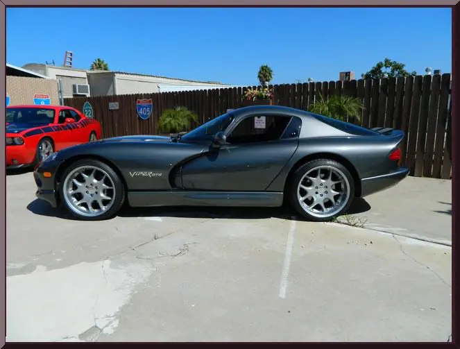 Side view of parked gray coupe