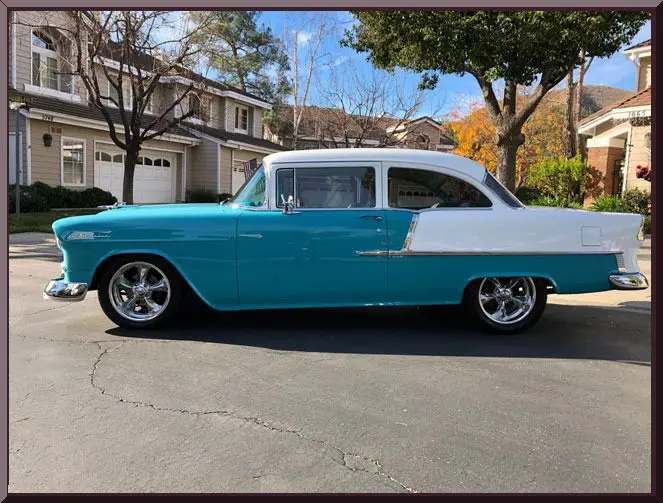 Classic car parked in suburban neighborhood
