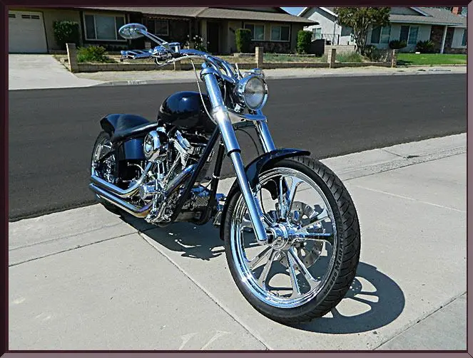 Custom chopper motorcycle in driveway
