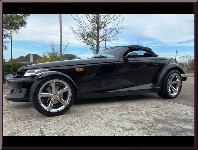 Sleek black roadster with chrome wheels