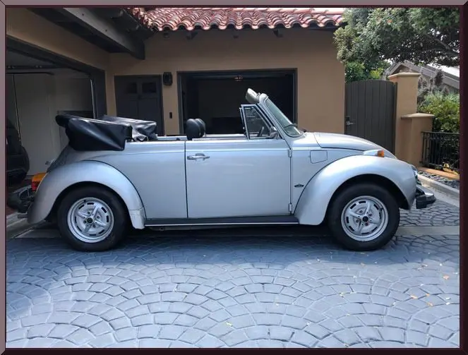 Classic convertible parked in driveway