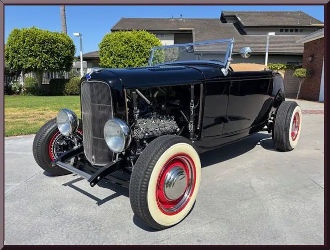 Retro car parked in suburban driveway