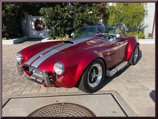 Vintage red car with silver stripes