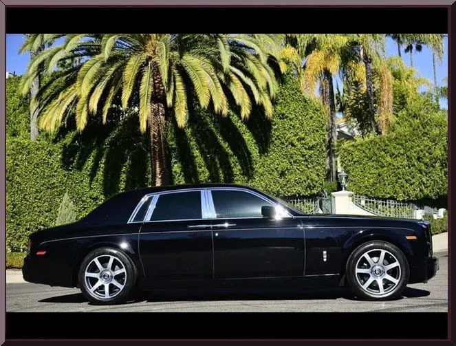 Sleek black car in sunny setting