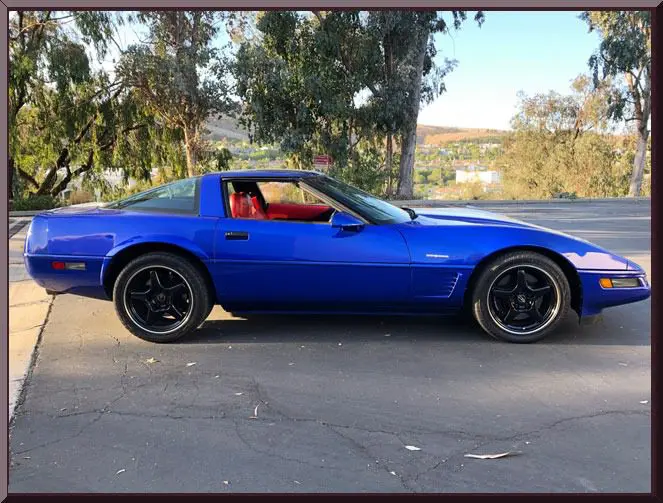 Classic blue car with black wheels