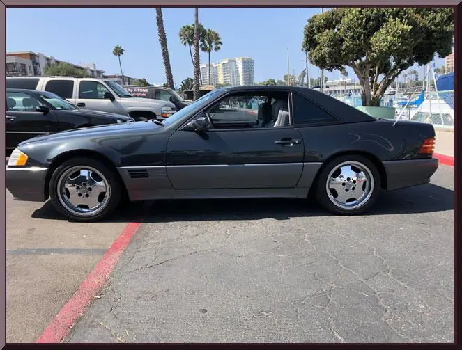 Sleek convertible near palm trees