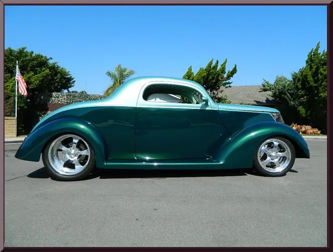 Classic car parked on a street.