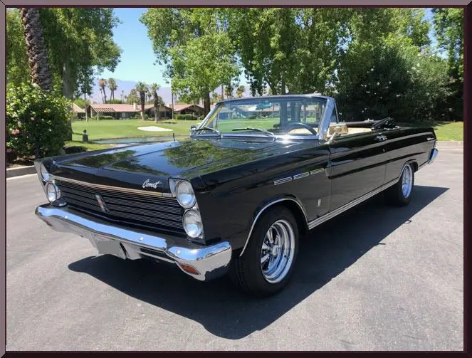 Vintage black convertible on road