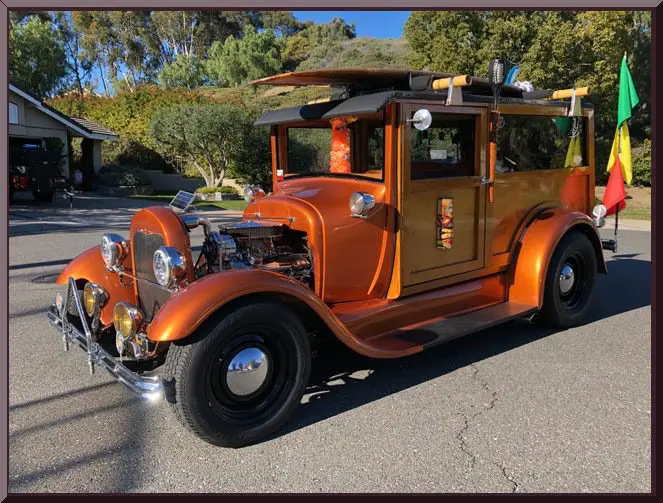 Classic car parked on sunny street