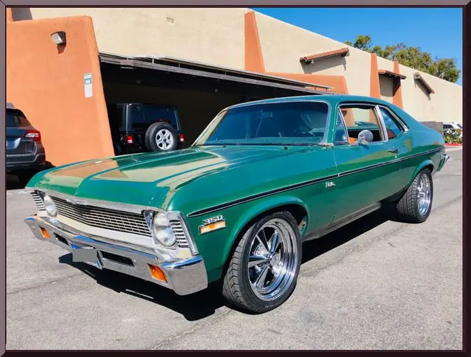 Retro green vehicle in parking lot