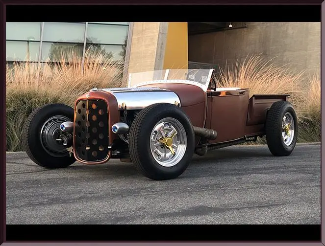 Vintage hot rod parked on street