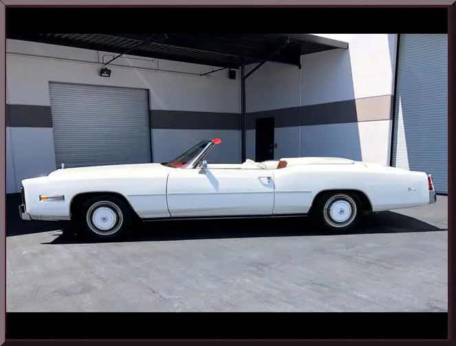 White classic convertible car parked outside