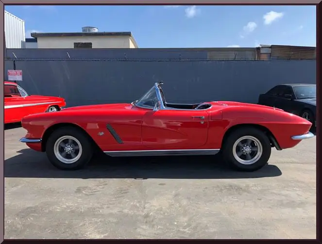 Classic red convertible parked outdoors