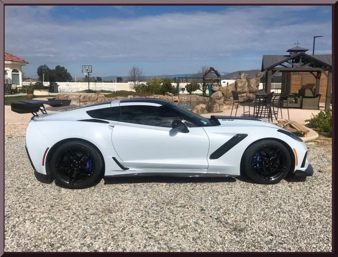 Sleek white car with black wheels