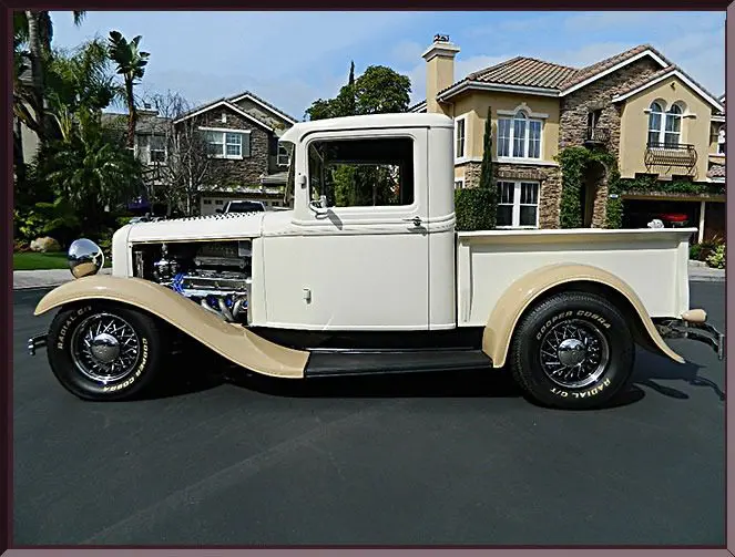 Classic truck parked outside houses