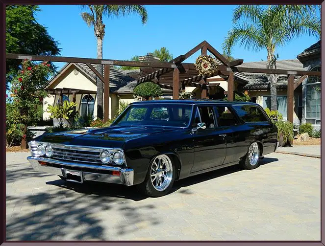 Retro station wagon near palm trees
