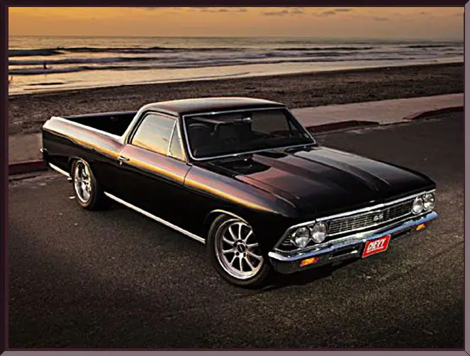 Classic black car by the beach