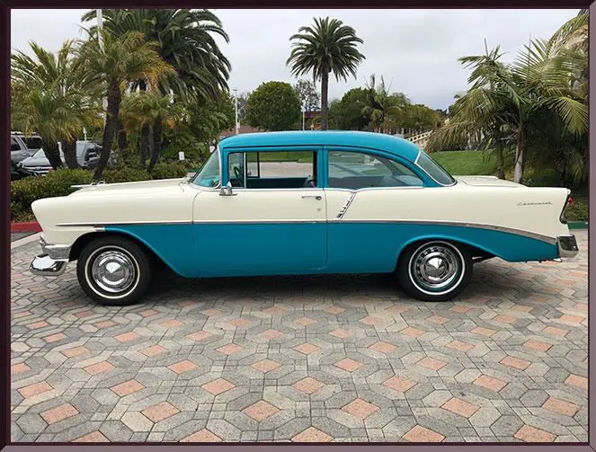 Teal and cream classic car side profile