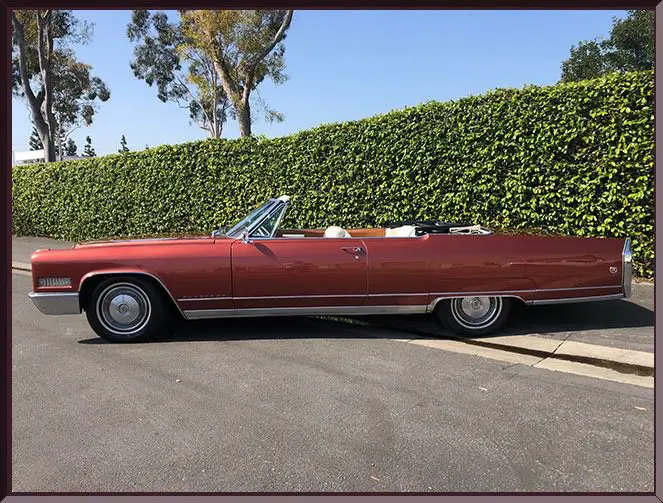 Red convertible car parked on street